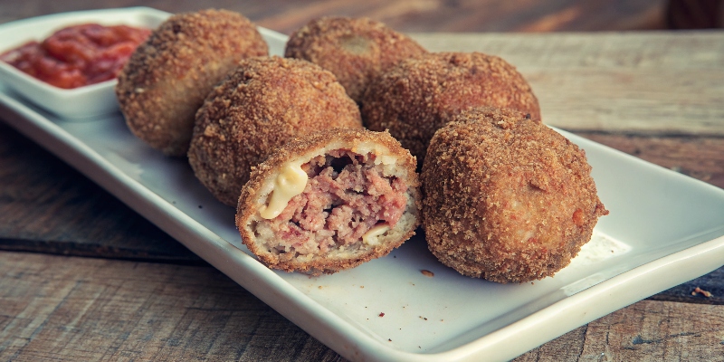 SPANISH MEAT‑FILLED POTATO BOMBAS